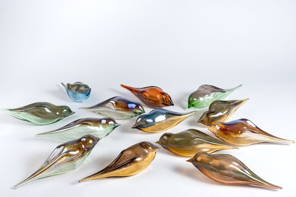 Perched birds by Feleksan Onar: colorful glass bird sculptures